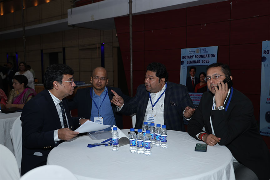 Premium conference setup with rows of chairs and branded podium, Kochi